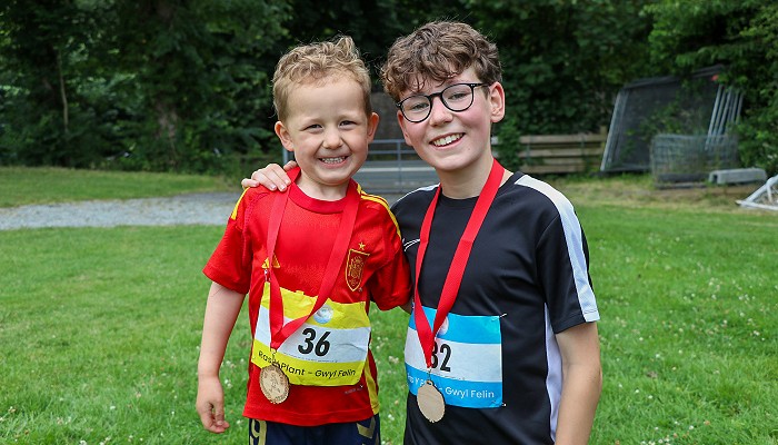 2 boys with their medals