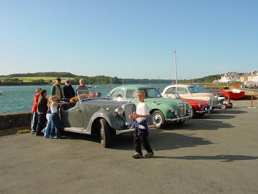 a row of colourful vintage cars