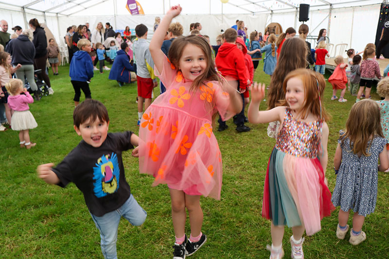 Children dancing in the marquee in Gwyl Felin