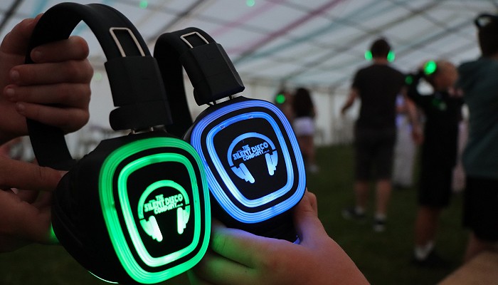 Silent disco headphones light up one green and one blue