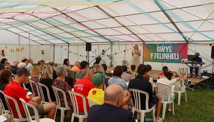 Community gathering in The Festival’s Religious Service in a marquee.